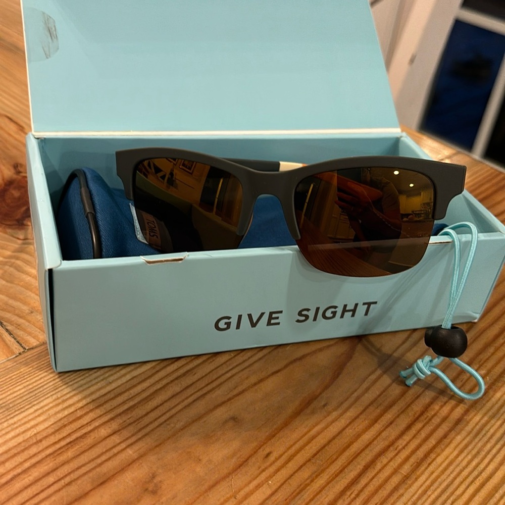 Tom’s sunglasses.  Unisex New with case and box